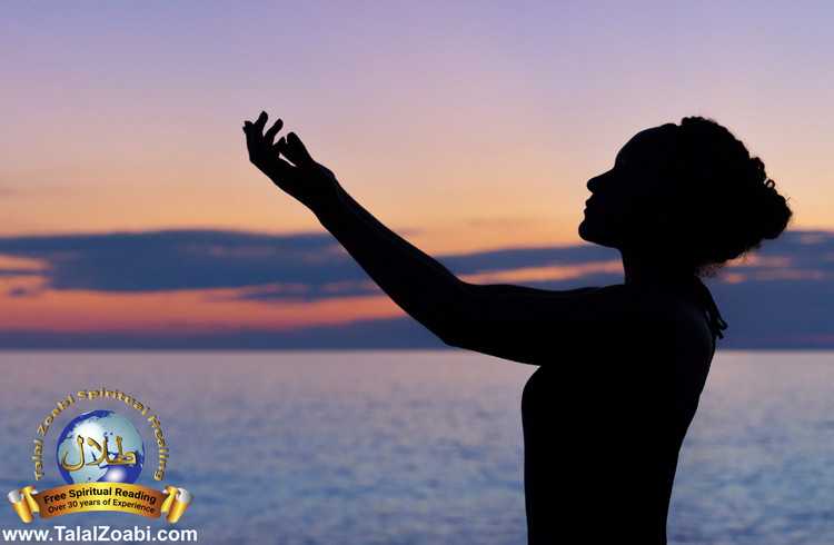 Woman standing in front of water who did spell removal.