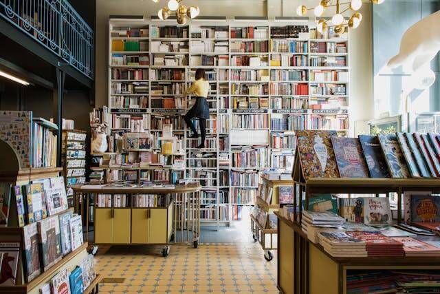 A person in a big library representing a spiritual healing blog.